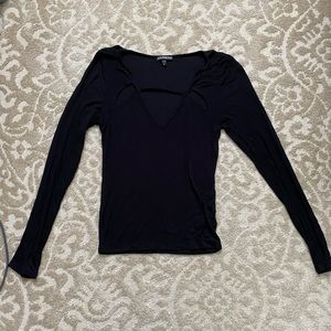 Black V-neck sweater.